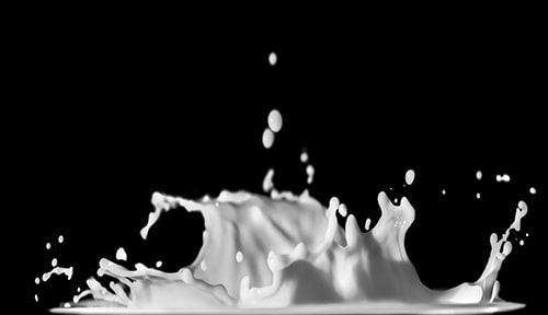 white milk splashing over a black background